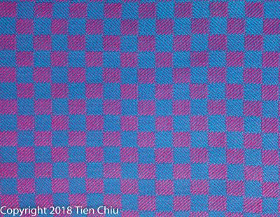 Handwoven cloth in magenta and blue