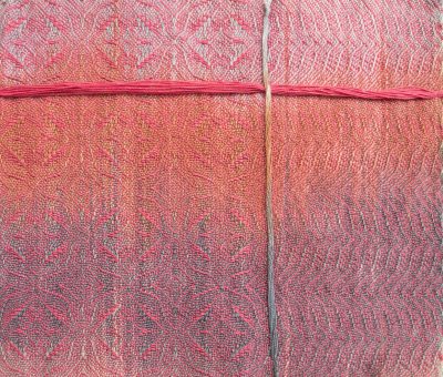 painted warp sample woven with a soft pink weft