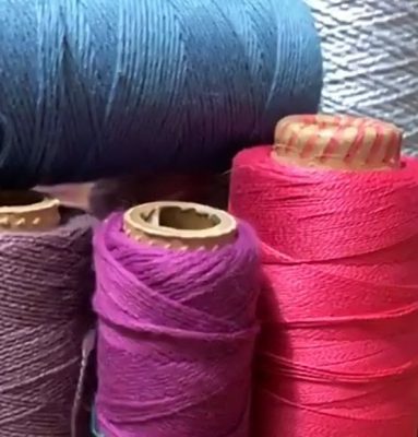 Four weft yarns: dull purple, orchid purple, screaming pink, and dull blue